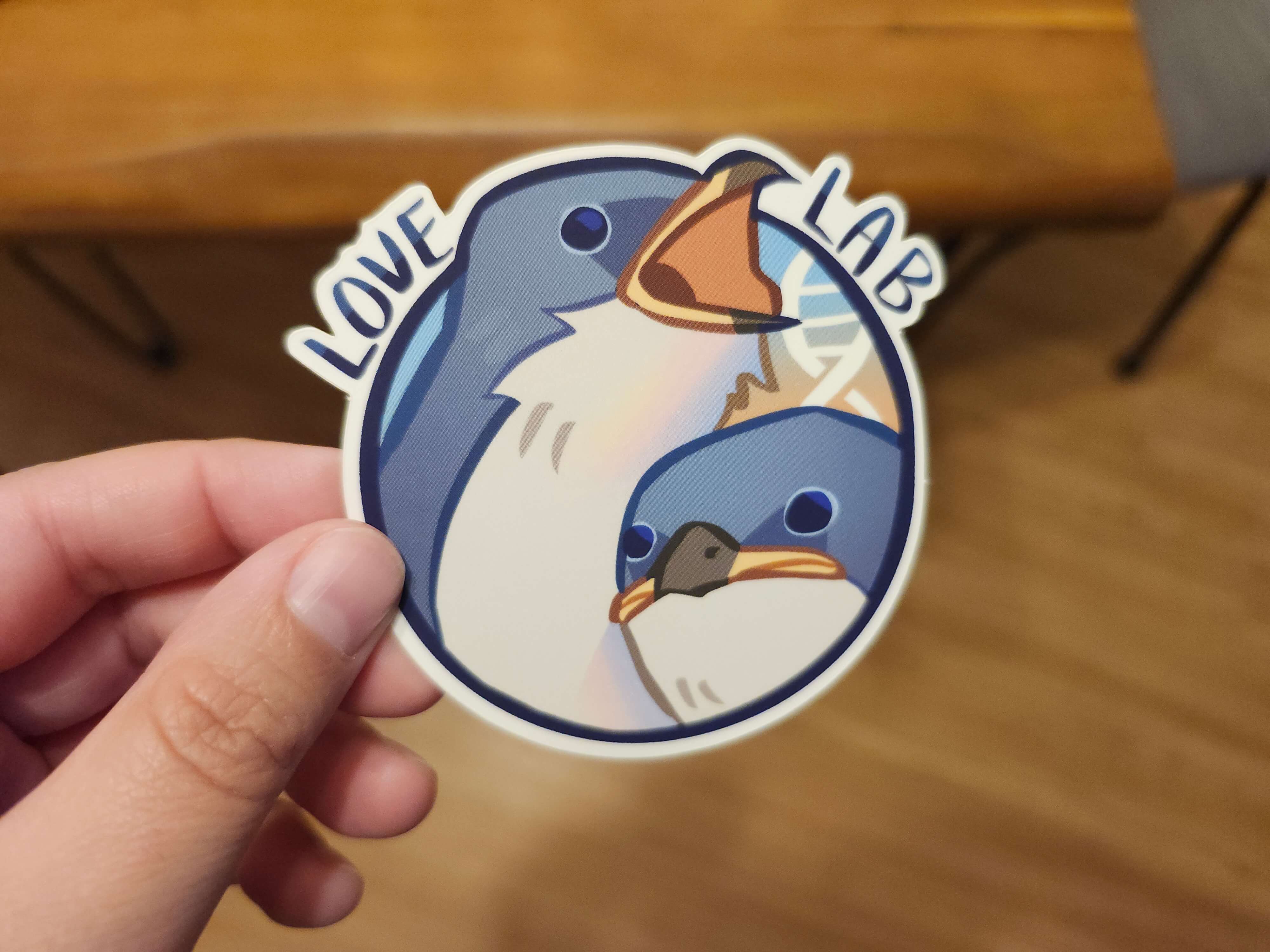 A photograph of a sticker with baby tree swallows.